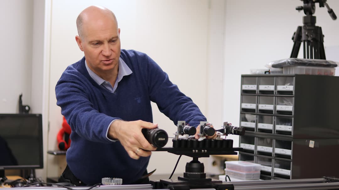 Mårten Sjöström working with a camera in the lab.