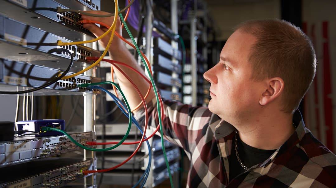 A man in a server room.