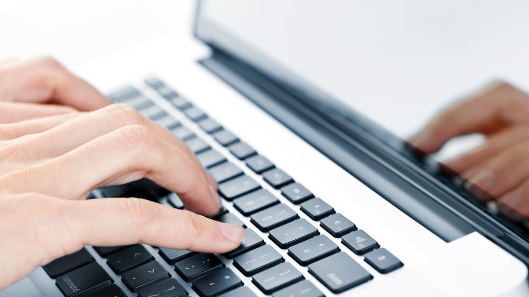 2202317-hands-typing-on-laptop-keyboard.jpg