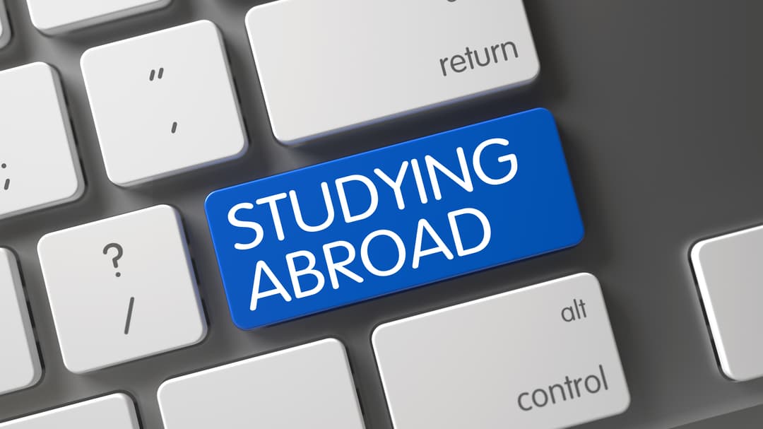 31308285-studying-abroad-blue-button-of-keypad-3d.jpg