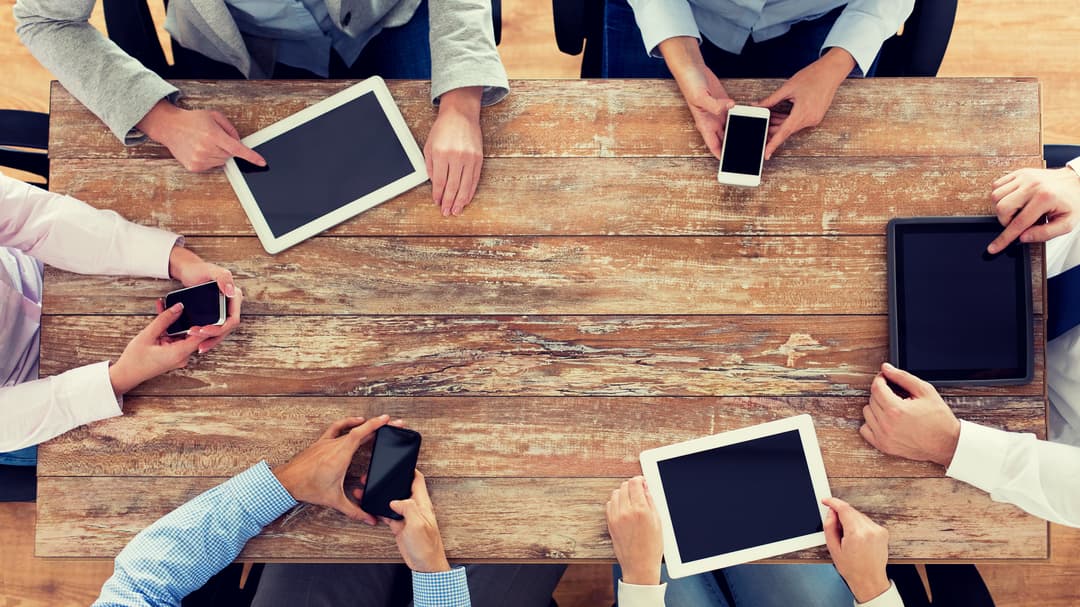 13716615-business-team-with-smartphones-and-tablet-pc.jpg