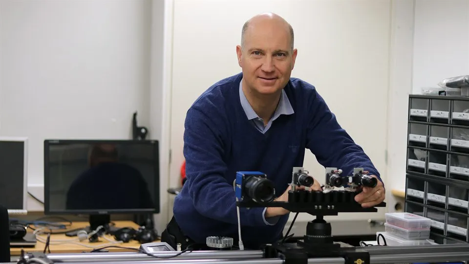 Mårten Sjöström working with a camera in the lab.