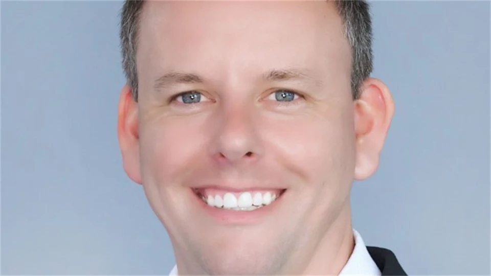 portrait of a man dressed in a black jacket and white skirt