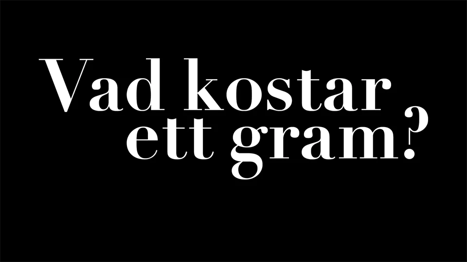 Affisch med vit text "Vad kostar ett gram?" mot svart bakgrund
