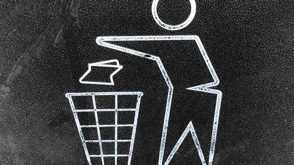 A simple illustration of a figure throwing trash into a trashcan