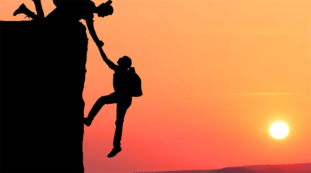 Teamwork couple hiking help each other trust assistance