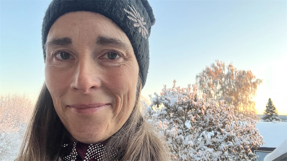 a woman with a hat on a winters day