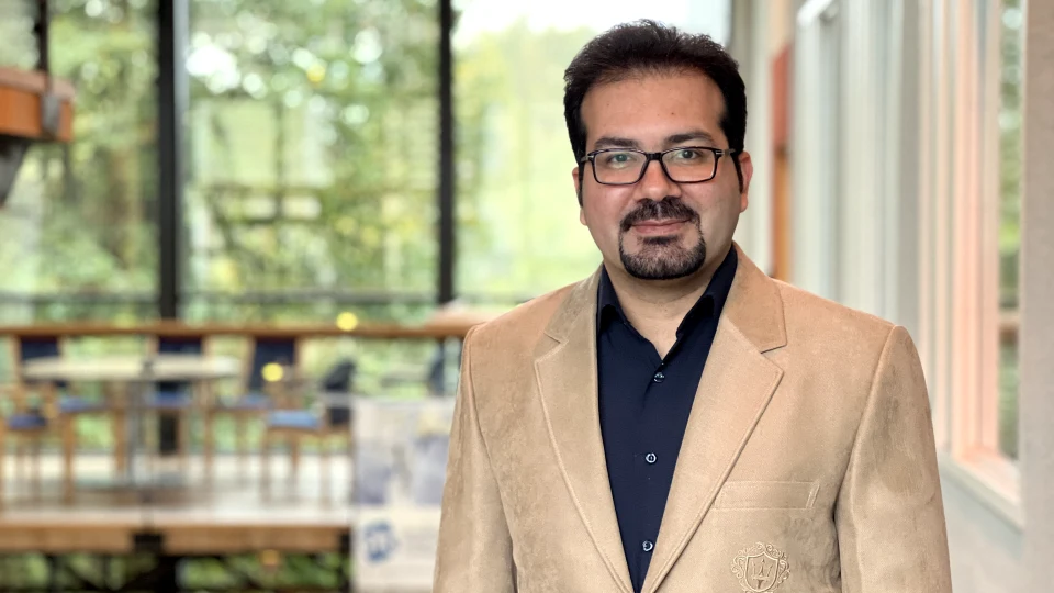 Man with glasses and a bright jacket