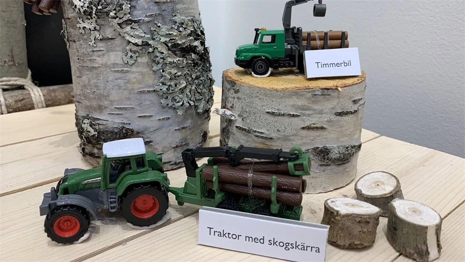 toy tractors at a table