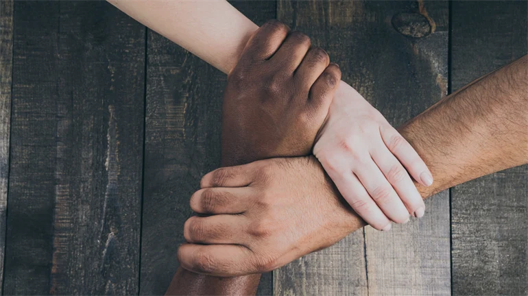 Team Hands Linked Together