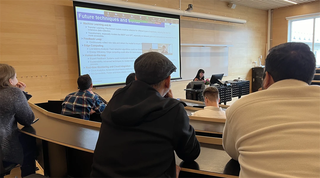 The audience sits and listens to a dissertation.