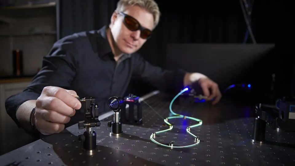 Researcher working with fiber optics.